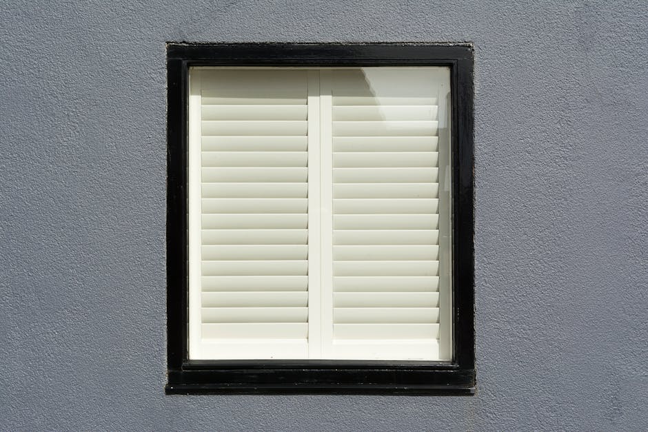 Elegant white wooden plantation shutters in a modern home